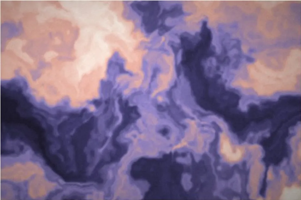 Abstract marbled texture in deep indigo, violet and pale peach.